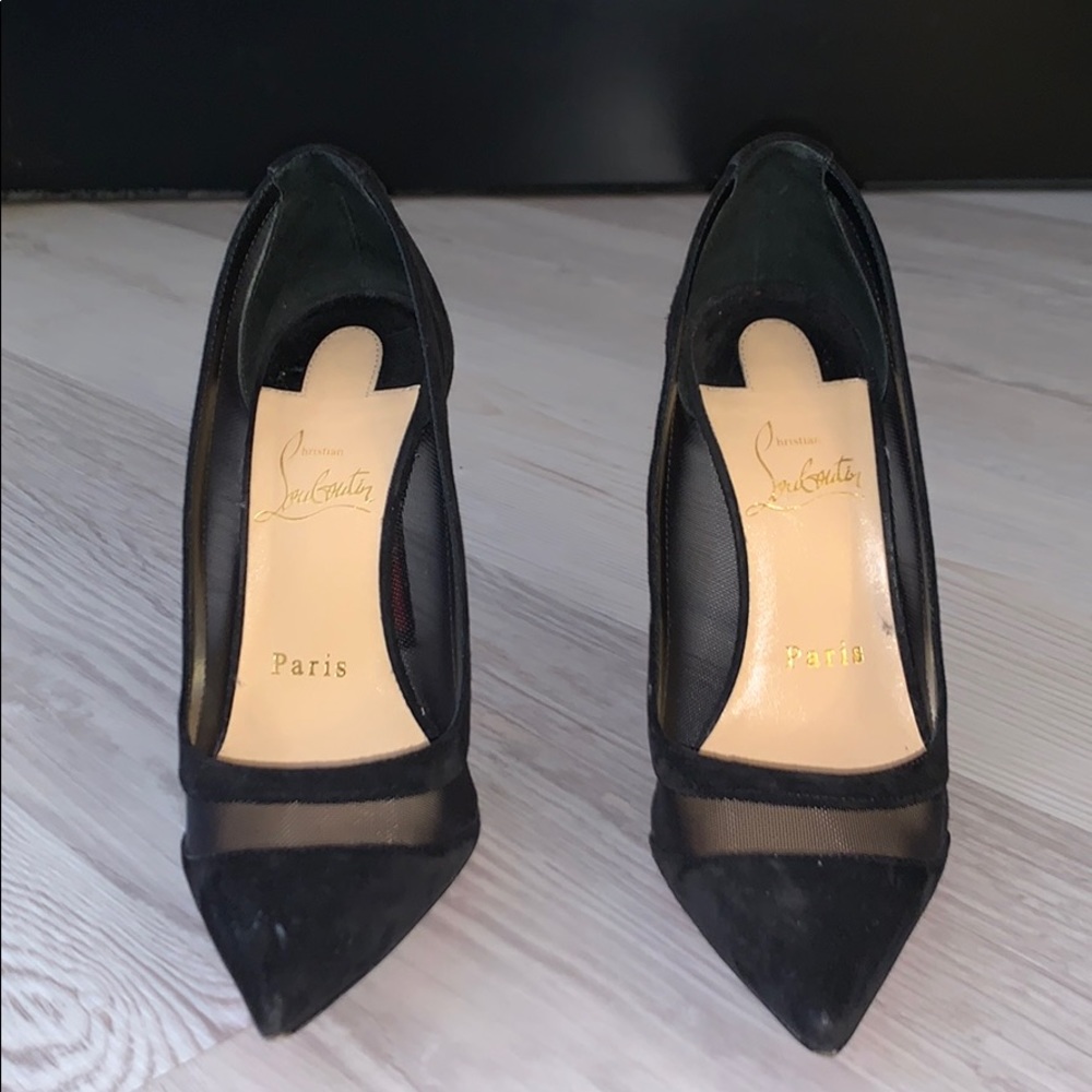 Black Christian Louboutin suede and mesh pumps.
